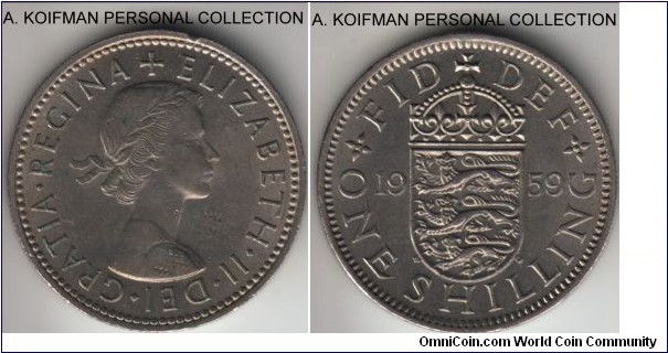 KM-904, 1959 Great Britain shilling; copper-nickel, reeded edge; reverse is almost uncirculated, but obverse shows some wear and a nick at the top.