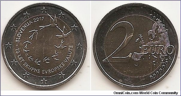 2 Euro KM#NEW 8.5000 g., Bi-Metallic Nickel-Brass center in Copper-Nickel ring, 25.75 mm. Subject : The 10th anniversary of the euro in Slovenia Obv: The design shows 10 flying swallows which form a circle. At the lower half, in semi-circle, the inscription ‘10 LET SKUPNE EVROPSKE VALUTE’. At the top left the inscription ‘SLOVENIJA 2017’. Between the isncriptions is engraved a dot. The coin’s outer ring bears the 12 stars of the European Union. Rev: 2 on the left-hand side, six straight lines run vertically between the lower and upper right-hand side of the face, 12 stars are superimposed on these lines, one just before the two ends of each line, superimposed on the mid - and upper section of these lines; the European continent ( extended ) is represented on the right-hand side of the face; the right-hand part of the representation is superimposed on the mid-section of the lines; the word ‘EURO’ is superimposed horizontally across the middle of the right-hand side of the face. Under the ‘O’ of EURO, the initials ‘LL’ of the engraver appear near the right-hand edge of the coin. Edge: S L O V E N I J A ·, fine milled. Obv. designer: Matej Ramšak Rev. designer: Luc Luycx