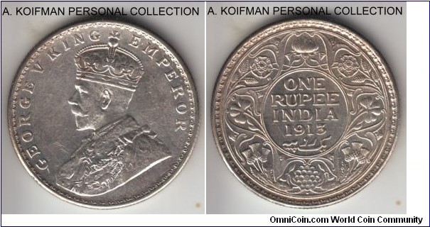 KM-524, 1913 British India rupee, Bombay mint (dot under flower); silver, reeded edge; common and abundant year, good grade - almost uncirculated to uncirculated.