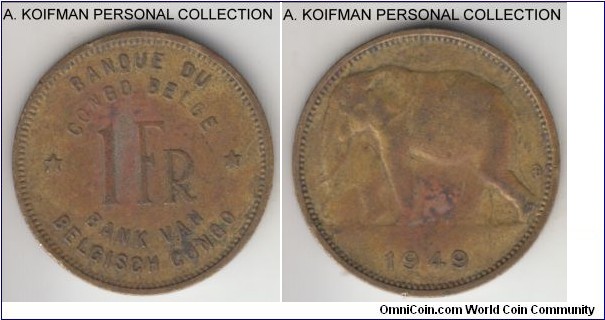 KM-26, 1949 Belgian Congo franc; brass, plain edge; minted in large quantities they are nevertheless scarce in high grade, this one is a toned very fine with storage and environmental discoloration