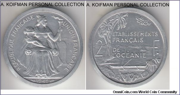 KM-PE3, 1949 French Oceania 2 francs; piefort with essai, aluminum, plain edge; scarce mintage 104, surfaces are good uncirculated, edge shows a small flan defect.