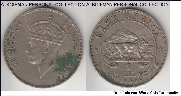 KM-31, 1950 East Africa shilling; copper-nickel, reeded edge; appear to have KN mint mark, with N more visible, about extra fine but stained.