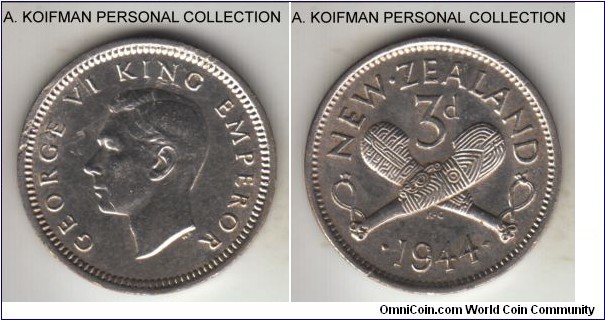 KM-7, 1944 New Zealand 3 pence; silver, plain edge; common world War II period issue, cleaned about uncirculated, flan defect - lamination) on obverse.