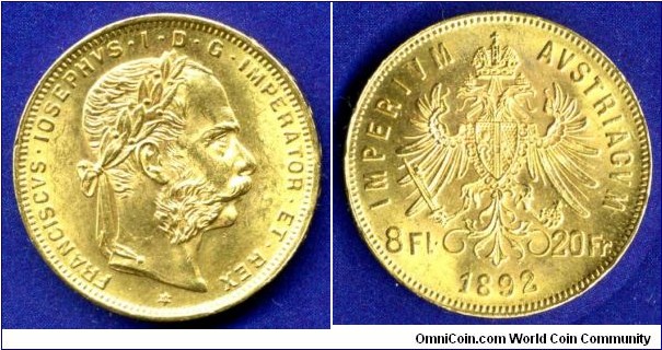 8 Florins/20 Francs.
Austro-Hungary empire.
Franc Ioseph I (1848-1916).
Portrait of the work of Anton Scharff (1845-1903).

Most likely it is the coinage of 1914-1915.

Au900f. 6,425gr.