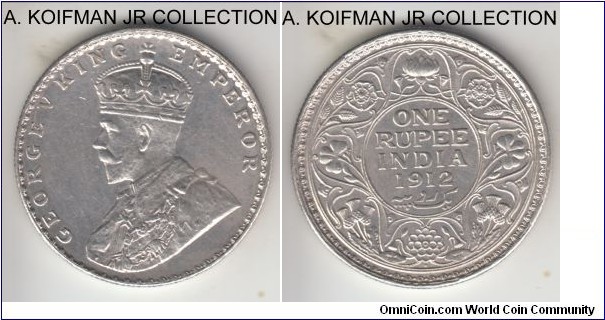 KM-524, 1912 British India rupee, Bombay mint (dot under flower); silver, reeded edge; George V early coinage, good details - extra fine or about, but cleaned.