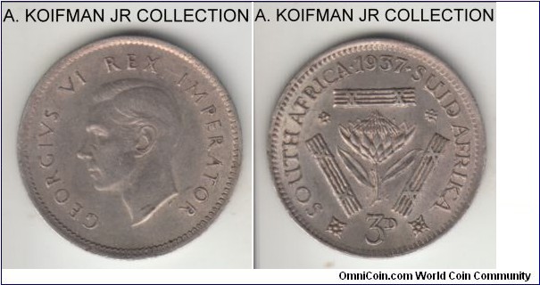 KM-26, 1937 South Africa (Dominion) 3 pence; silver, plain edge; first year of George VI, toned and a bit dirty extra fine with much undelying reverse luster, interestingly struck by unbalanced press as left side of obverse is clearly less well struck than the right side.