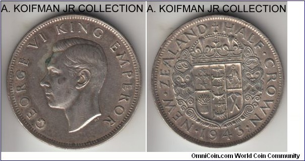 KM-11, 1943 New Zealand half crown; silver, reeded edge; George VI, war time coinage and common issue, average circulated, about very fine, some extra metal around the rims.
