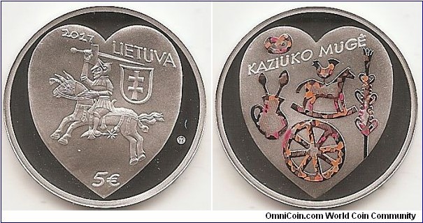 5 Euro KM#230 Silver Ag 925 Quality proof Diameter 28.70 mm Weight 12.44 g. Series: Traditional Lithuanian Celebrations. The obverse of the coin features a non-traditional Vytis, inspired by fragments of hearth tiles from the time of Casimir Jagiellon (Kazimieras Jogailaitis), found in Vilnius Lower Castle. The coat of arms is surrounded by the inscription LIETUVA (LITHUANIA), date of issue (2017), denomination (€5), and the mintmark of the Lithuanian Mint. Against a heart-shaped background, the reverse of the coin features the most distinctive attributes of Kaziukas’ Fair: a verba, pitcher, spoons, hobby horse, rooster, ring-shaped roll, and a wagon wheel. Designed by Rytas Jonas Belevičius. Mintage 2,000 pcs. Issued 03-03-2017. The coin was minted at the state enterprise Lithuanian Mint.