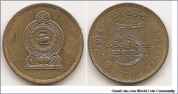 5 Rupees
KM#148.2a
7.67 g., Brass Plated Steel, 23.49 mm. Obv: The emblem of Sri Lanka Rev: The denomination in the center surrounded by the country name with the date at the bottom Edge: Reeded and Lettered Edge Lettering: CBSL repeated in various languages 