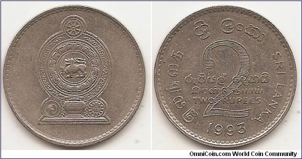 2 Rupees
KM#147
8.25 g., Copper-Nickel, 28.5 mm.  Obv: National arms Rev: The large numeral 2 at the centre with TWO RUPEES in Sinhala, Tamil and English superimposed. SRI LANKA in Sinhala appear at the apex of the coin and in Tamil and English on ether side. The year of issue is at the bottom. Edge: Reeded 