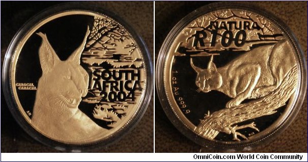 Crazy LAUNCH cage & silver statue & 2nd coin ONLY(see other pics) with certificate, (Au Coin is no longer available)

NATURA Wild Cats of Africa Launch Set - Caracal (2004)

Info about the original coin if you want to compare to what you have was:

Mint Mark - Caracal Caracal
Manufacturer: South African Mint
Issuing Country: South Africa
Year: 2004
Brands: South African Natura
Denomination: 100 Rand
Metal: Gold
Purity: 999.9
Metal Content: 1 Troy Ounce
Weight: 31.107 Grams
Diameter: 32.69mm
Quality: Gold Proof
Issue Limit: 300 Worldwide
Presentation: Boxed with Certificate and original purch invoice.

Presented in a 