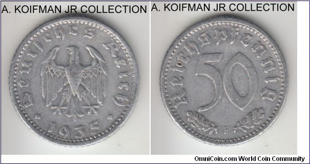 KM-87, 1935 Germany (Third Reich) reichsmark, Stuttgart mint (F mint mark); aluminum, reeded edge; 1-year type, good very fine, attempted piercing or punch on reverse.