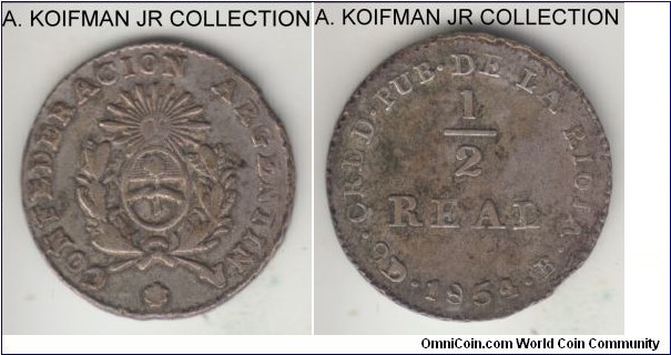 KM-23, 1854 Argentina Rioja 1/2 real; silver, laureate corded edge; Rioja provincial issue by Buenos Aires mint, very fine or almost, possibly ex-jewelry with loop removed.