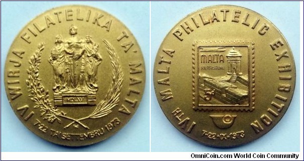 Medal - IVth Malta Philatelic Exhibition. Bronze gilt. Diameter; 38mm. Design by George M. Pace. The Great Siege Monument on obverse. Reproduction of the 5 penny stamp on reverse. Minted in the number of 400 pcs.