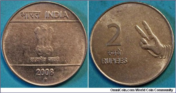 2 Rupees. With part of the Hasta Mudra (hand signs)series on reverse. Stainless steel, 27mm