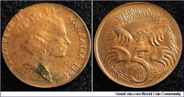 Australia 1994 5 cents overstruck over Singapore 1978 (?) 1 cent. Unique? Weight: 1.75g