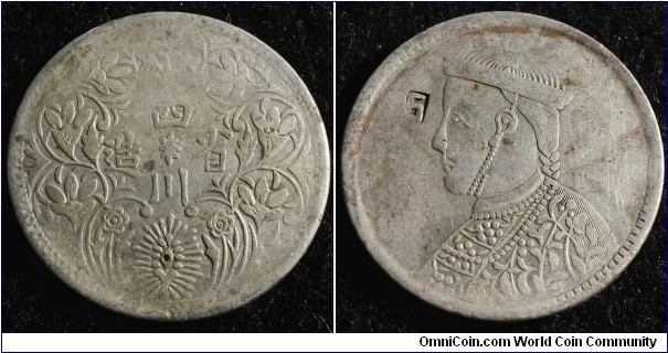 China Szechuan Tibet rupee (ND: 1939 - 1942). This is struck in lower grade silver. (40%) You can see traces of red because of this. Weight: 11.17g