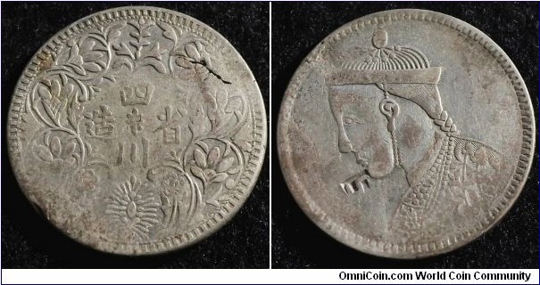 China Szechuan Tibet rupee (ND: 1939 - 1942). This is struck in lower grade silver. (40%) You can see traces of red because of this. Planchet flaw. Weight: 11.00g