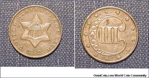 1852 Silver 3 Cent Piece.  These are tiny, smaller than a dime.