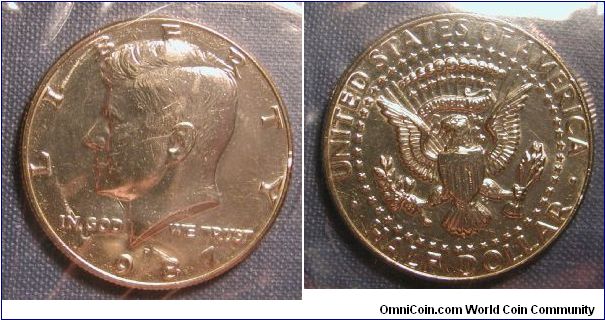 1987-P Kennedy Half Dollar from Uncirculated Mint Set in original packaging.