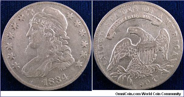 1834 Capped-bust half dollar. Grades about XF.