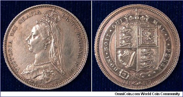 1887 Jubilee head sixpence. The coin is un-cirulated but an old cleaning is evident.