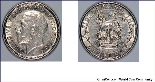 The hair engraving has changed on this 1926 sixpence, compare it with our 1924 example.
The toothed border on the obverse is also larger.