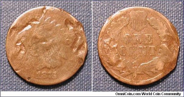 1875 Indian Head Cent the worst Indian Head Cent I have ever seen.  This thing is completely mangled.