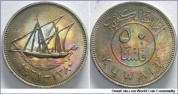 50 fils.

I may have obverse and reverse backwards.                                                                                                                                                                                                                                                                                                                                                                                                                                                               