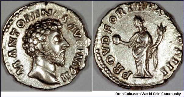 The coin shown is a silver denarius of Marcus Aurelius.
Bare headed portrait, with curly hair and beard, facing right, with the legend M ANTONINUS AUG IMP II.
The reverse shows Providence holding globe and cornucopiae, with the legend PROV D FOR TRP (XVII or XVIII possibly XVIIII) COS III.
These titles date this coin to 163, assuming that the failure to mention ARMENIACUS eliminates the possibility of 164 AD.