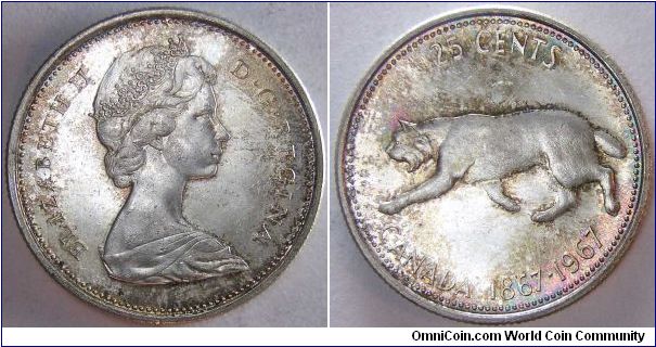 Centennial quarter dollar.

Nice rainbow toning.                                                                                                                                                                                                                                                                                                                                                                                                                                                                  