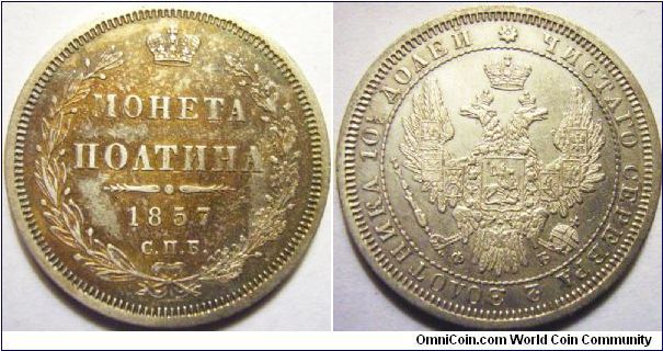 Russia 1857 poltina or half ruble. Somewhat proof-like but with horrid scratchs and possible dip on the obverse. A stab was very close to the right side of the double headed eagle... Regardless, high grades of poltinas for some odd reasons are difficult to locate...