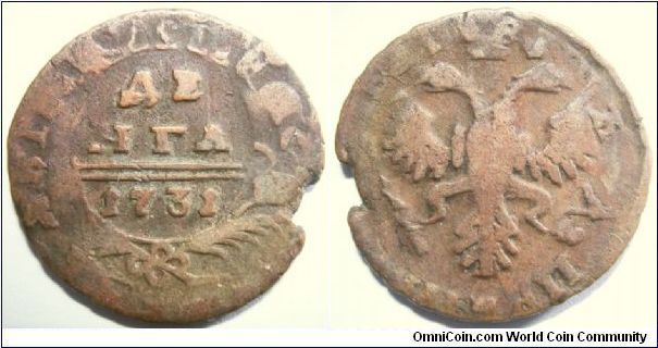 Russia 1731 1 denga overstruck on 1716 MD(?). Has some details of the previous host coin. As you see carefully, you can see the head of the rider popping out on the right side of the double headed eagle!!!