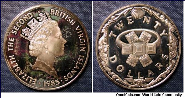 1985 British Virgin Islands 20 Dollar Silver Proof. Purple/green toning.  KM# 51 20 dollars
weight 19.0900 g.
composition 0.9250 Silver 0.5678 oz. ASW