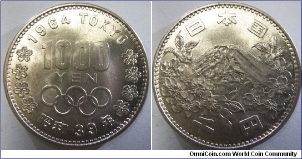 Japan 1964 1000 yen. An extremely high denomination silver crown that is minted way over it's metal value. This is the only year that 1000 yen coins were made to circulate but these soon disappeared because of the high denomination value and silver content.