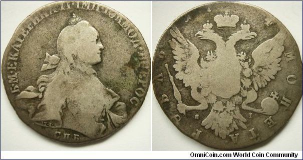 Russia 1764 1 ruble. The third digit is missing but it seems that this coin was minted in 1764, not 54 or 74 due to different designs and mintmaster marks. 

Obverse seems to be a F, whereas the reverse is a G. Overall, VG.