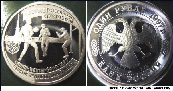 Russia 1997 1 ruble, first out of the five of the 100th Anniversary of the Russian Football. 

This coin features the first football in St. Petersburg.

Minted in Ag925 and in 1/4 oz. Pretty small... 

You can see the folder at no. 901738.