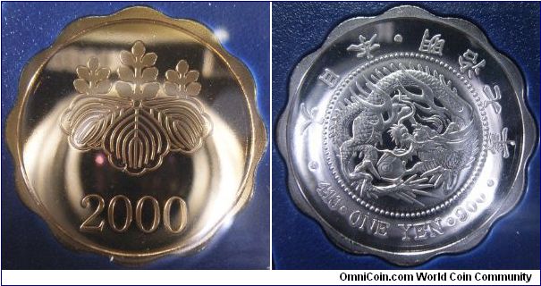 Medal that comes together with the Japan 2000 Proof set. Note that it features a 1874 1 yen coin, the first coin that was minted for the Far East. The obverse is gold-plated and features a paulownia.