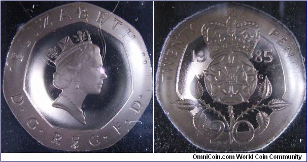UK 1985 proof 20 pence. Featuring the Badge of England as well as double rose. Interesting 7 sided coin.