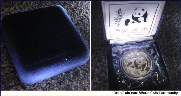 Box of China 10 yuan silver proof panda. Comes with the coin in coin capsule, box, COA and some extra PVC coating around the coin capsule.