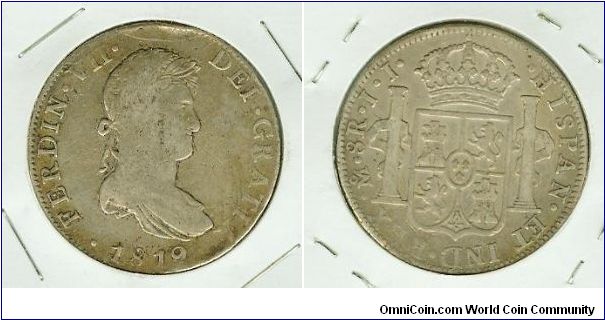 Mexico-Philippines 1819 Ferdin VII 8 Reales. One of the many Silver Crown 8 Reales coins that found its way into circulation in the Philippines during the Spanish occupation. This guy was ped on his head at some time, as evidenced by the rim-ding at 12 o'clock. A Nice, highly collectable coin!