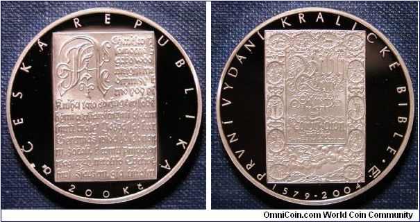 2004 Czech Republic 200 Koruna Kralice Bible 425 Years Proof.

.900 silver
31mm
13g
Mintage 5,000

Celebrates the 425th anniversary of the printing of the original Kralice Bible, the first standard of literary Czech language.

The Kralice Bible was the first Czech translation of the Bible from the original languages, prepared and edited by Unitas Fratrum (later known as the Moravian Church). It was printed during 1579-93 in six volumes by Zacharias Solin Slavkovsky.