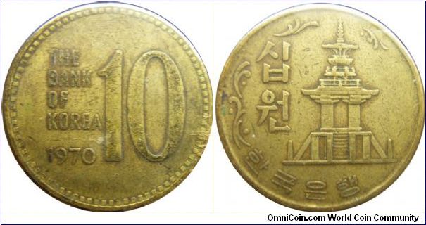 S. Korea 1970 10 won. Gold color! Notice that this is the year when the transitional metal changes were made. And hence the color change that explains the color of the earlier coins of why they were red. I am not too sure which is rarer though.