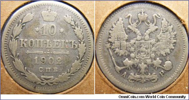 Russia 1902 10 kopeks. Worn till it's a good old thin chip.