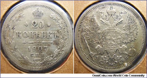 Russia 1907 20 kopeks. Odd how the obverse strike seems to be striked by a smaller die than usual?