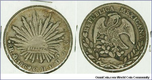 MEXICO 1869 MO/CH 8 REALES SILVER CAP N' RAYS CROWN. THESE COINS WERE CIRCULATED IN THE PHILIPPINES DURING THE SPANISH OCCUPATION.