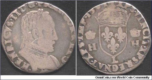 A silver teston issued during the first year of reign of Charles IX. During this year money continued to be struck bearing the effigy of Henri II. This one was minted at Bayonne (L mm)