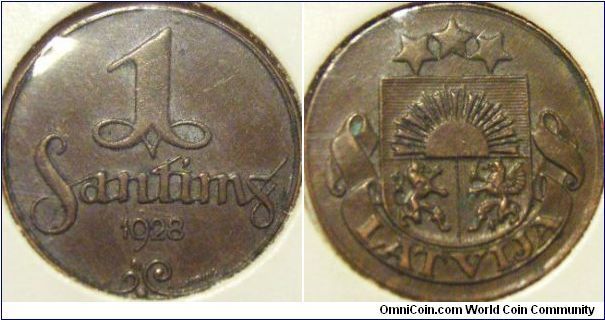 Latvia 1928 1 santims. Minted in copper, grade is somewhat aXF. With little verdigis at the left ribbon crest. Lowered to $3.50