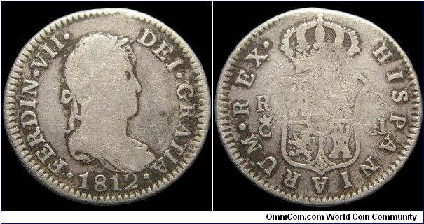 2 Reales, Bourbon Kingdom of Spain.

Ferdinand VII is featured on this coin. At this same period Joesph Napoleon was also known as the King of Spain and the Ferdinand coins are actually more difficult to come across. When you do see one of his coins with a wartime date it was usually made in one of Spain's colonies.                                                                                                                                                                                     