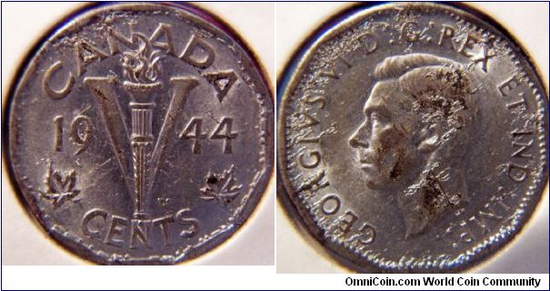 1944 Canadian 5 Cent with a few problem areas.